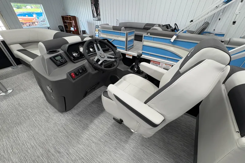 Slide: The Image of Interior of 2026 Bennington 22 SSR Stern Radius SNAP pontoon boat, featuring helm and seating. - 12