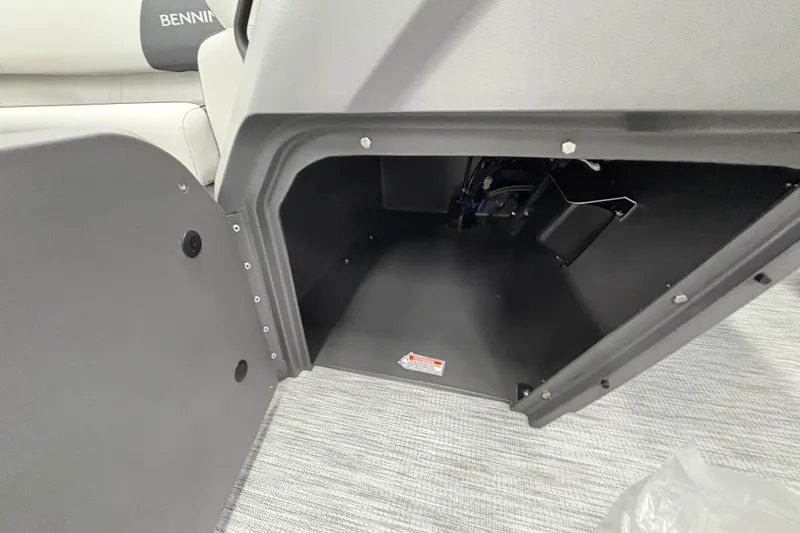 Slide: The Image of Open storage compartment in 2026 Bennington 22 SSR Stern Radius SNAP boat interior. - 14