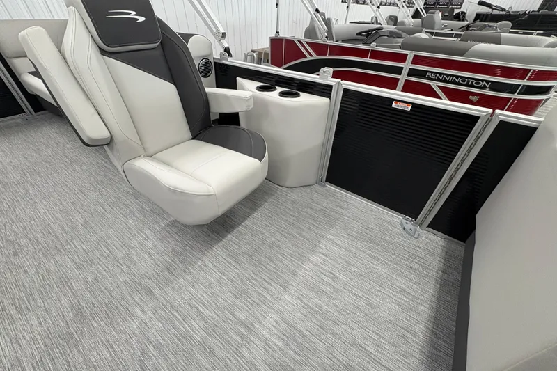 Slide: The Image of 2026 Bennington 22 SSR Stern Radius SNAP boat interior with plush seating and cup holders. - 15