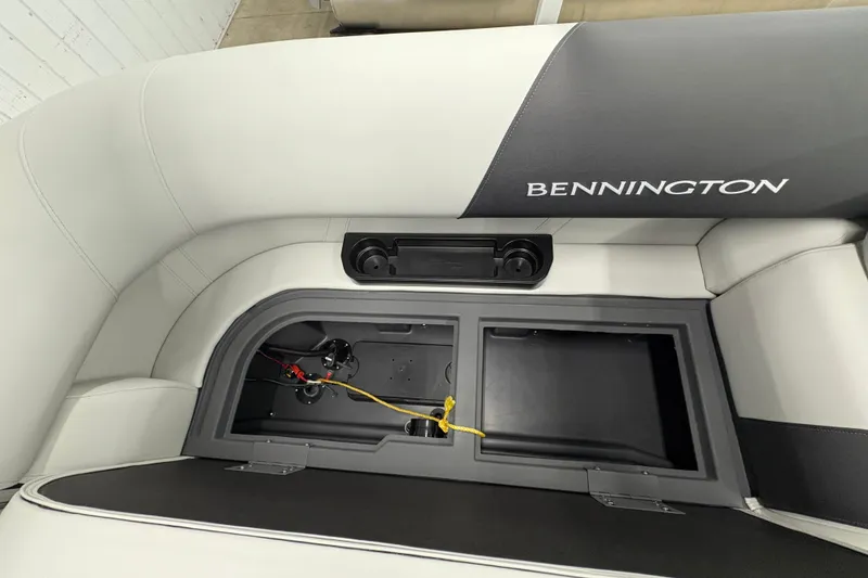 Slide: The Image of 2026 Bennington 22 SSR Stern Radius SNAP boat seat storage compartment open. - 20