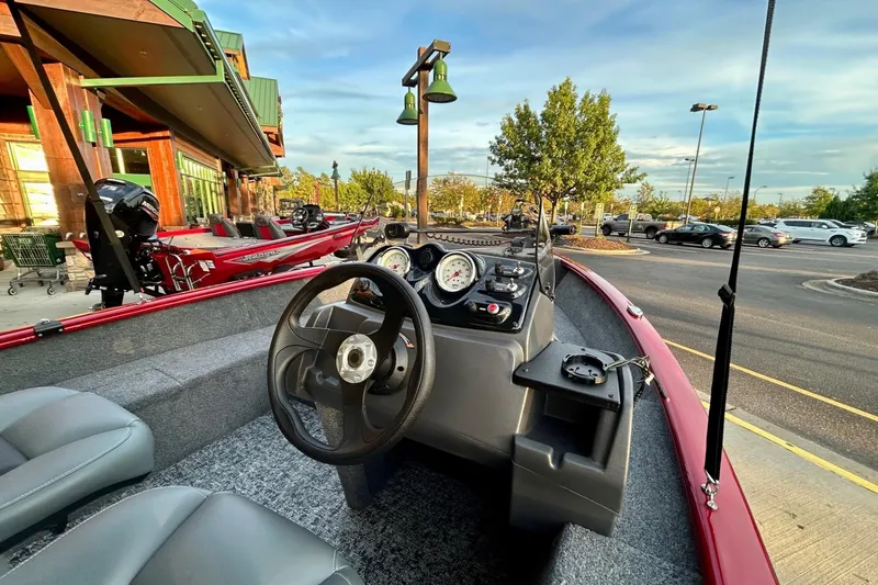 Slide: The Image of 2026 Tracker Super Guide V-16 SC boat interior with steering wheel and dashboard. - 3