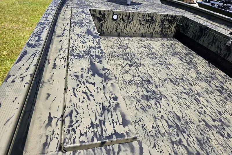 Slide: The Image of 2026 Tracker Grizzly 1654 T Sportsman boat with camouflage interior design. - 10