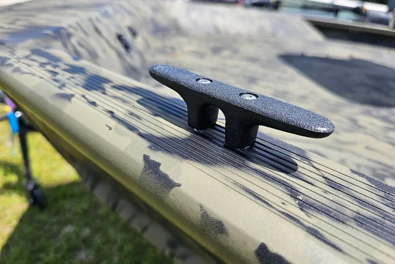 Slide: The Image of 2026 Tracker Grizzly 1654 T Sportsman boat cleat on camouflage-patterned surface. - 17