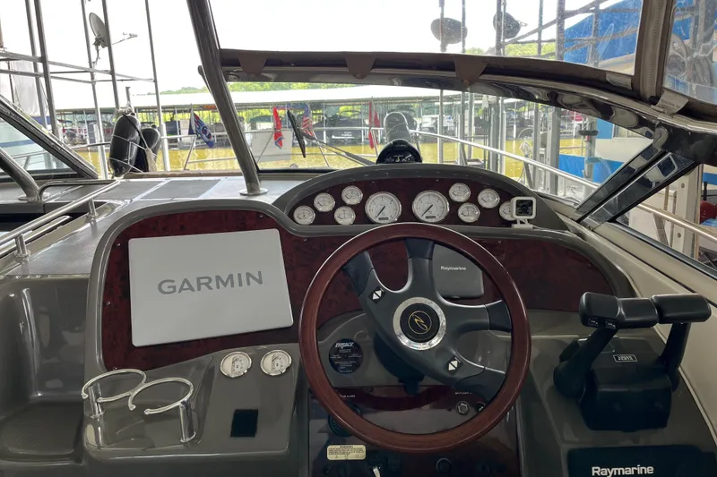 Slide: The Image of 2007 Regal 3760 IB Commodore boat dashboard with Garmin and Raymarine equipment. - 11