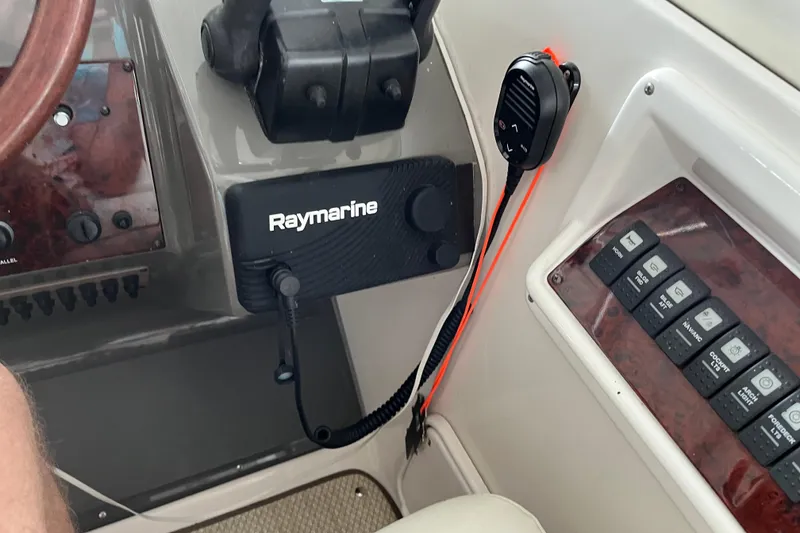 Slide: The Image of 2007 Regal 3760 IB COMMODORE dashboard with Raymarine equipment and control panel. - 15