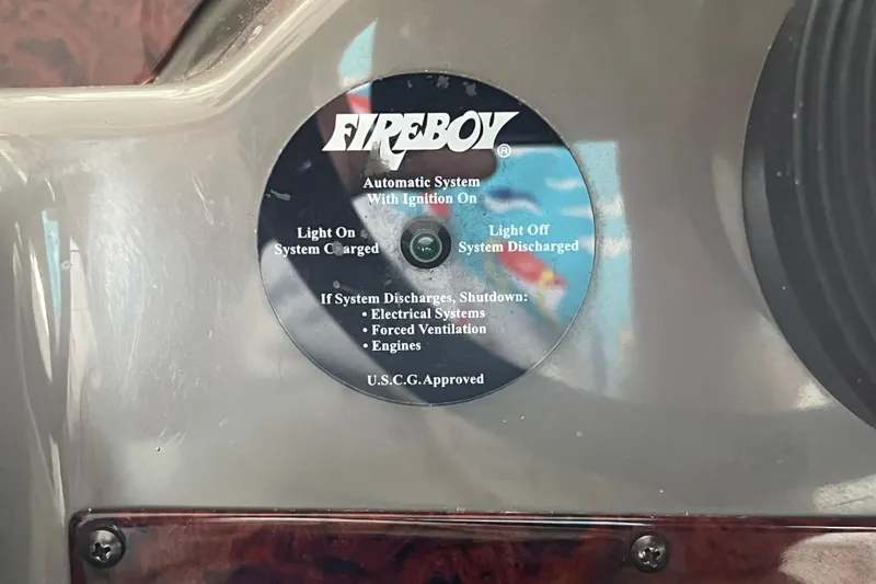 Slide: The Image of Fireboy automatic system indicator on 2007 Regal 3760 IB Commodore boat dashboard. - 17