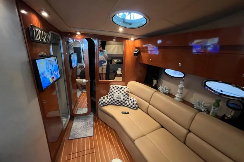 Slide: The Image of Luxurious interior of 2007 Regal 3760 IB Commodore yacht with cozy seating and decor. - 23