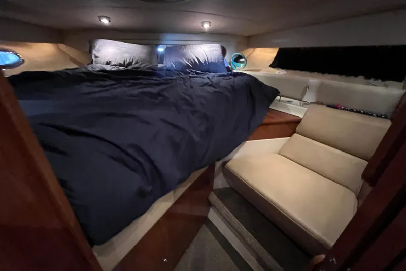 Slide: The Image of Luxurious cabin interior of 2007 Regal 3760 IB Commodore yacht with cozy bed and seating. - 26