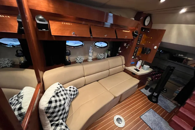 Slide: The Image of Luxurious interior of 2007 Regal 3760 IB Commodore yacht with beige seating and wood accents. - 29