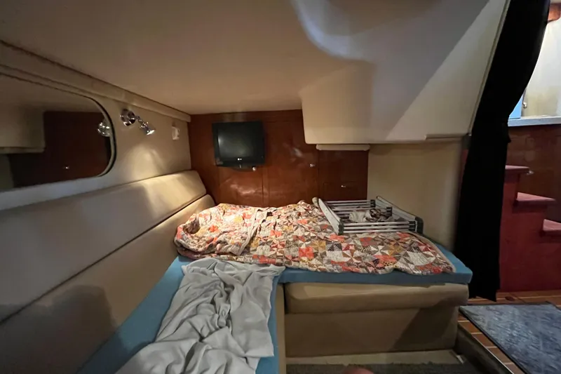Slide: The Image of 2007 Regal 3760 IB Commodore cabin with bed, TV, and cozy decor. - 35