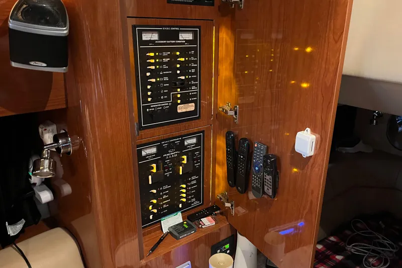 Slide: The Image of Control panel inside 2007 Regal 3760 IB Commodore yacht with remotes and switches. - 36