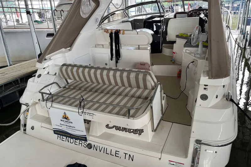 Slide: The Image of 2007 Regal 3760 IB Commodore yacht with striped seating, docked in Hendersonville, TN. - 7