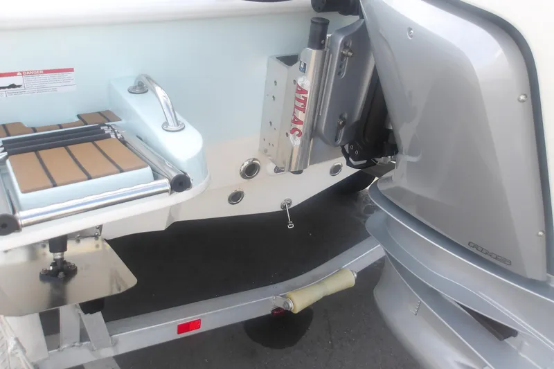 Slide: The Image of 2025 Ranger 2360 Bay boat with Atlas jack plate and outboard motor. - 9