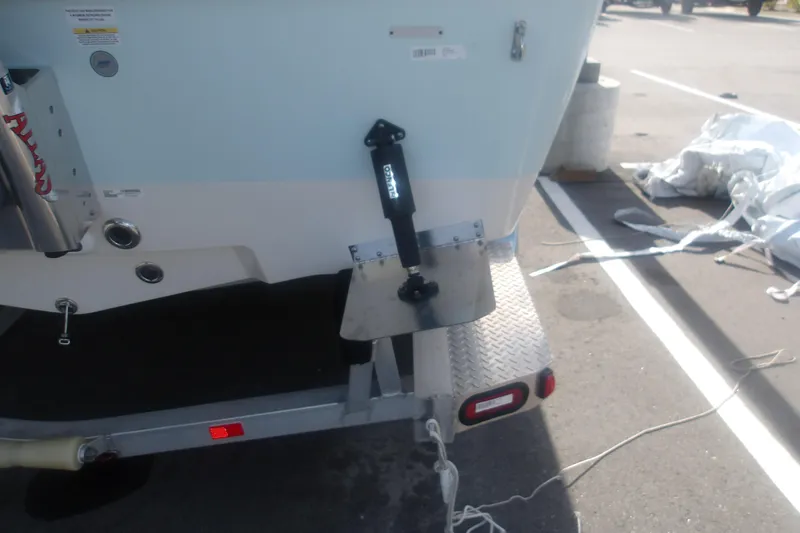 Slide: The Image of Rear view of a 2025 Ranger 2360 Bay boat on a trailer in a parking lot. - 8