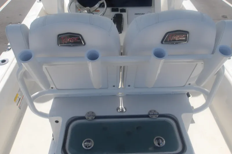 Slide: The Image of 2025 Ranger 2360 Bay boat interior with dual seats and rod holders. - 20
