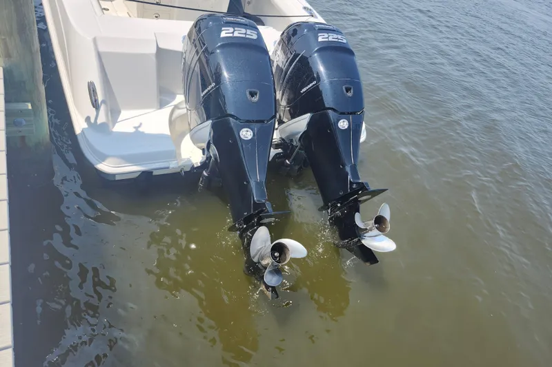 Slide: The Image of 2016 Boston Whaler 250 Outrage with twin 225 horsepower outboard engines in water. - 20