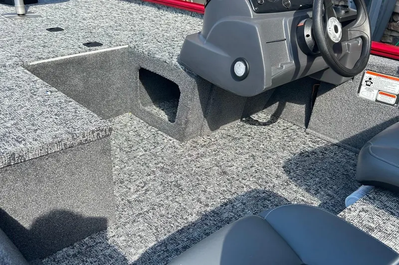 Slide: The Image of 2026 Tracker Pro 170 boat rear view with motor and red hull. - 2