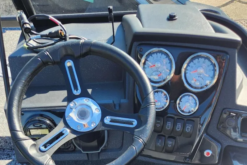 Slide: The Image of Steering wheel and dashboard of 2026 Tracker Targa V-18 Combo boat. - 11