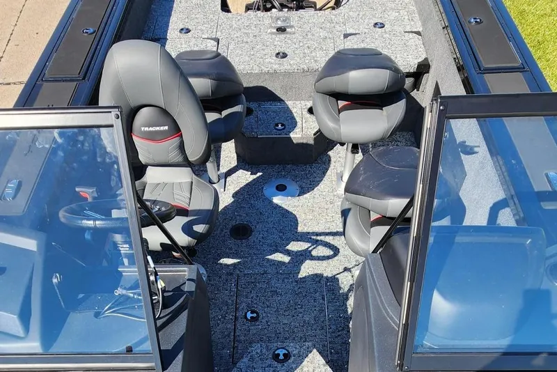 Slide: The Image of 2026 Tracker Targa V-18 Combo boat interior with seating and steering wheel. - 14