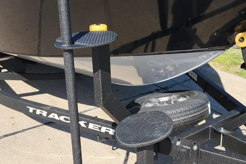 Slide: The Image of 2026 Tracker Targa V-18 Combo boat trailer with spare tire and step platform. - 6