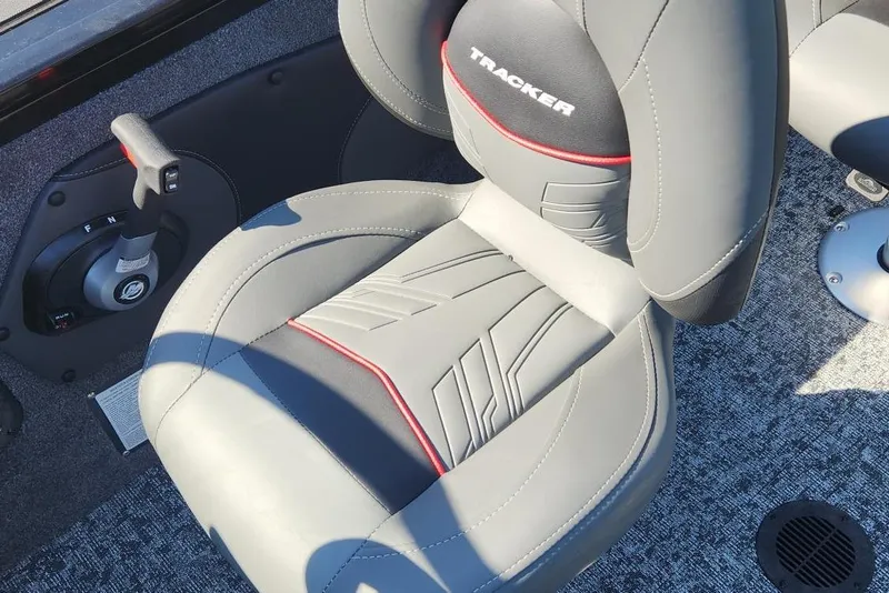 Slide: The Image of Tracker Targa V-18 Combo 2026 boat seat with sleek design and control lever. - 9