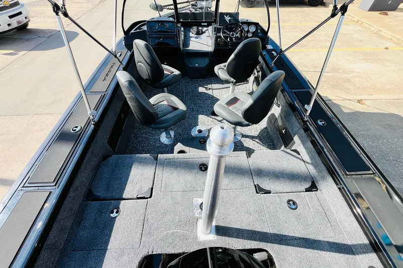 Slide: The Image of 2026 Tracker Targa V-18 Combo boat interior with seating and control panel. - 10