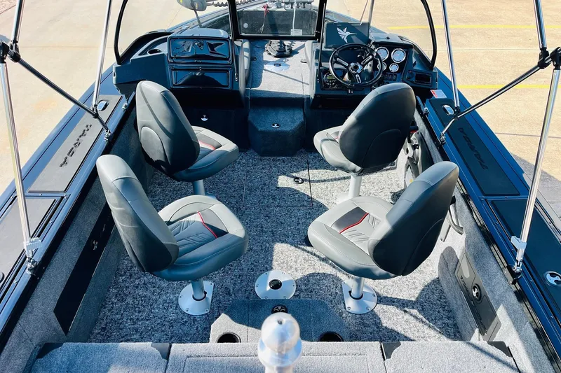 Slide: The Image of 2026 Tracker Targa V-18 Combo boat interior with four seats and steering console. - 11