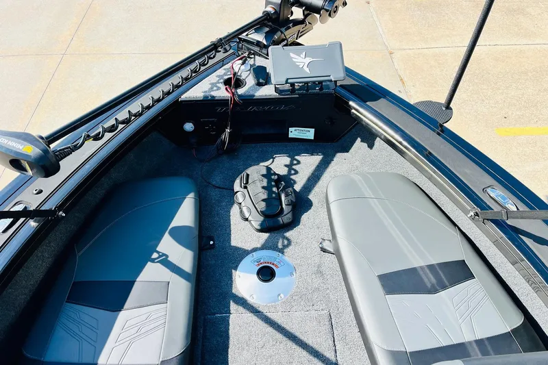 Slide: The Image of 2026 Tracker Targa V-18 Combo boat interior with seating and control panel. - 13
