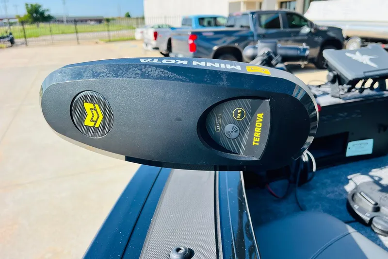 Slide: The Image of Minn Kota Terrova motor on 2026 Tracker Targa V-18 Combo boat, parked outdoors. - 14