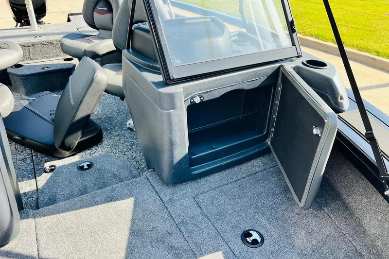Slide: The Image of 2026 Tracker Targa V-18 Combo boat interior with open storage compartment and seating. - 25