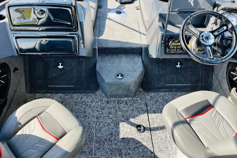 Slide: The Image of 2026 Tracker Targa V-18 Combo boat interior with steering wheel and seating. - 27