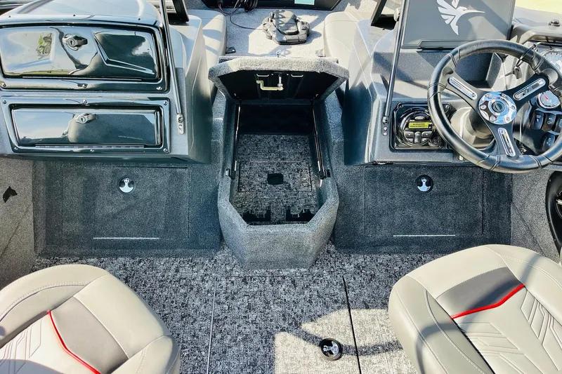 Slide: The Image of 2026 Tracker Targa V-18 Combo boat interior with steering wheel and seating. - 28
