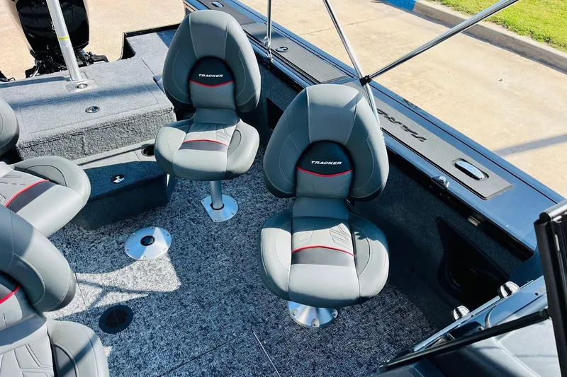 Slide: The Image of 2026 Tracker Targa V-18 Combo boat interior with gray seating and carpeted flooring. - 36