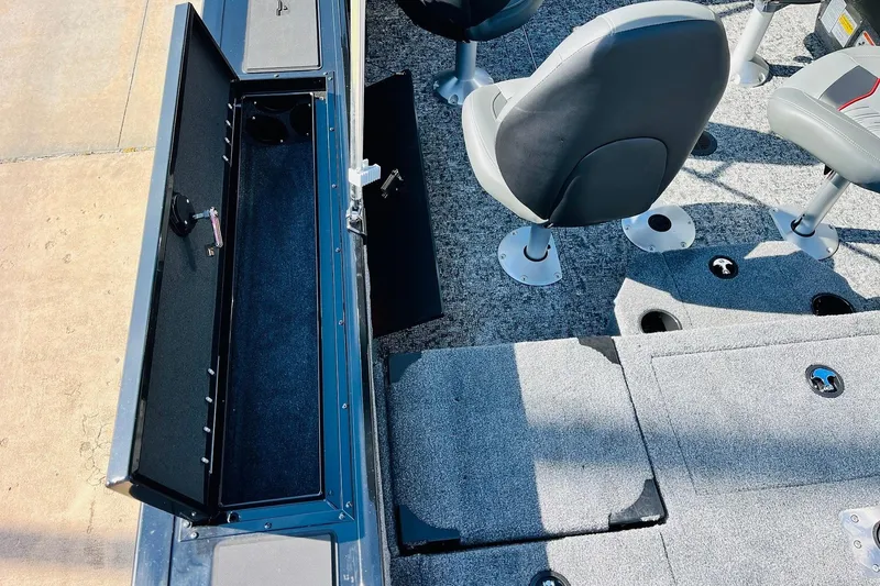 Slide: The Image of 2026 Tracker Targa V-18 Combo boat interior with seating and storage compartments. - 38
