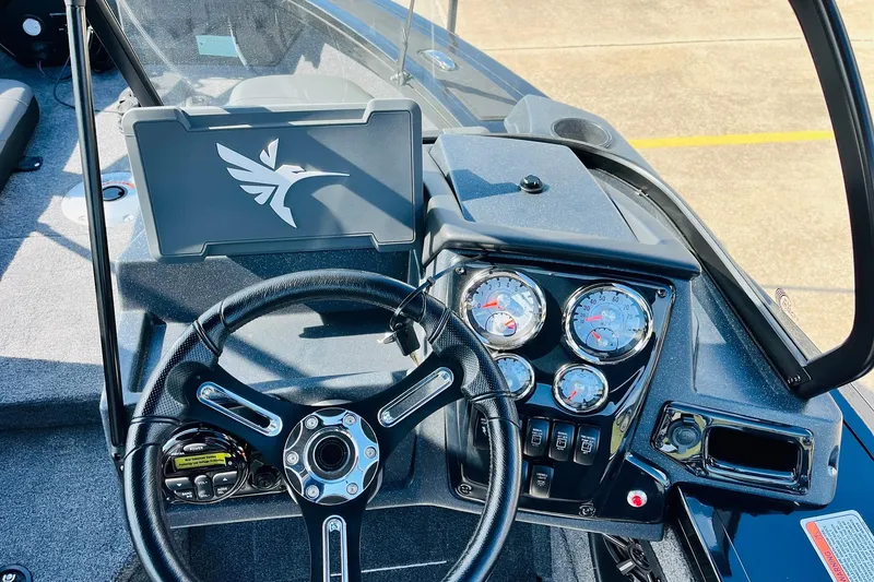 Slide: The Image of Steering console of 2026 Tracker Targa V-18 Combo boat with gauges and controls. - 42