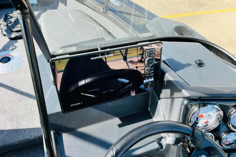 Slide: The Image of 2026 Tracker Targa V-18 Combo dashboard with Humminbird Xplore 9 display and gauges. - 44