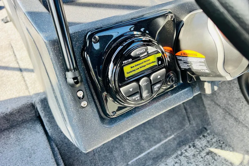 Slide: The Image of Control panel of 2026 Tracker Targa V-18 Combo boat with warning labels. - 45