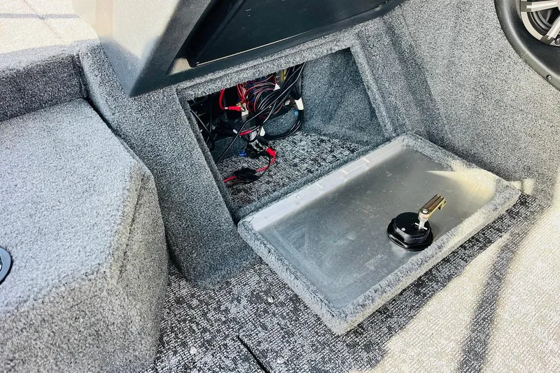 Slide: The Image of Interior view of 2026 Tracker Targa V-18 Combo boat showing wiring and storage compartment. - 48