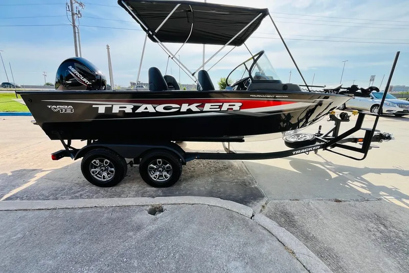 Slide: The Image of 2026 Tracker Targa V-18 Combo boat on trailer, side view, outdoors. - 5