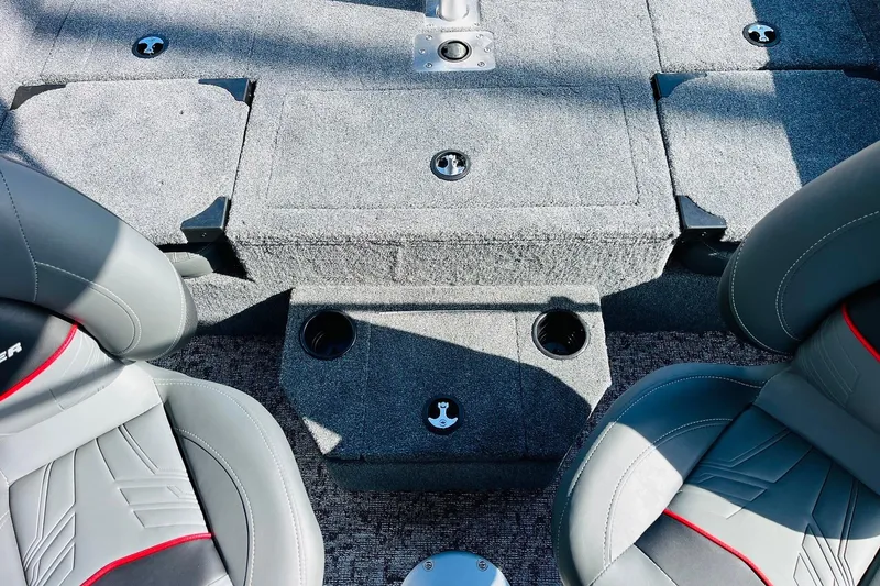 Slide: The Image of 2026 Tracker Targa V-18 Combo boat interior with gray seating and storage compartments. - 53