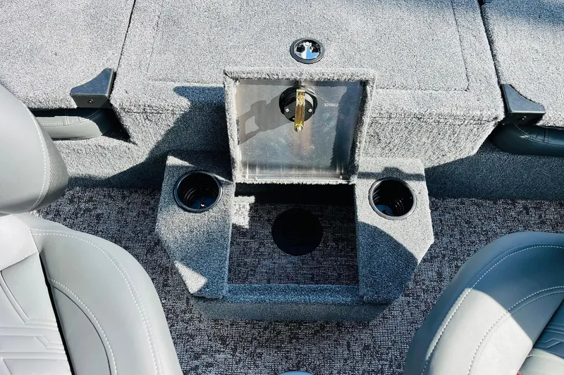 Slide: The Image of Interior of 2026 Tracker Targa V-18 Combo boat with cup holders and storage compartment. - 54