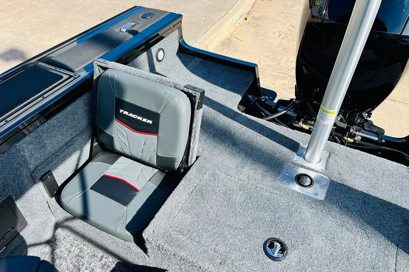 Slide: The Image of 2026 Tracker Targa V-18 Combo boat interior with seating and motor details. - 58