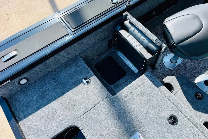 Slide: The Image of 2026 Tracker Targa V-18 Combo boat interior with seating and storage compartments. - 60