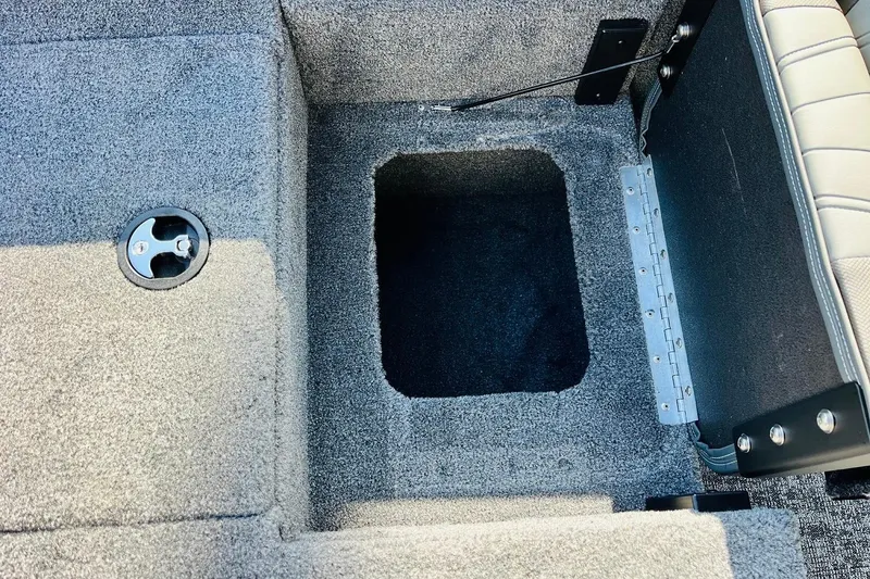 Slide: The Image of Carpeted storage compartment in 2026 Tracker Targa V-18 Combo boat interior. - 61