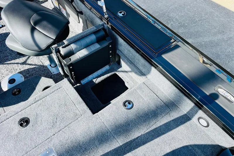 Slide: The Image of Interior view of 2026 Tracker Targa V-18 Combo boat, featuring seating and storage compartments. - 65