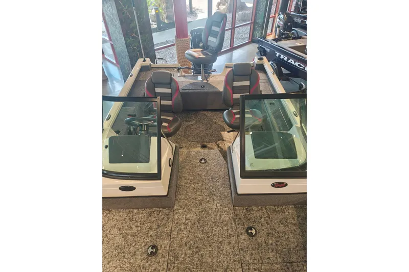 Slide: The Image of 2025 Ranger VS1682SC Reata boat interior with seating and steering console. - 7