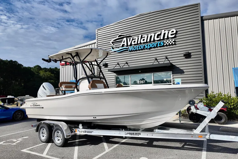 The Image of 2026 Pioneer 220 Baysport boat on trailer at Avalanche Motorsports dealership. - 1