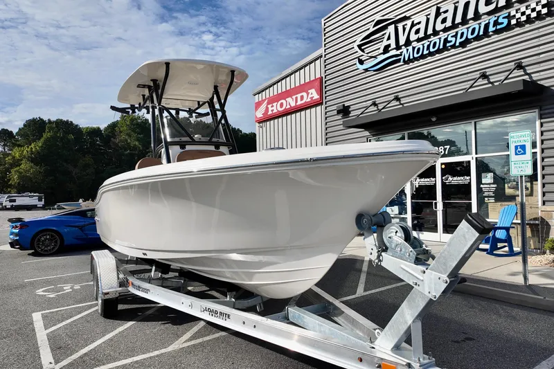 Slide: The Image of 2026 Pioneer 220 Baysport boat on trailer at Avalanche Motorsports dealership. - 4
