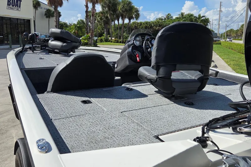 Slide: The Image of 2023 Tracker Pro Team 195 TXW Tournament Edition boat interior with seating and controls. - 11
