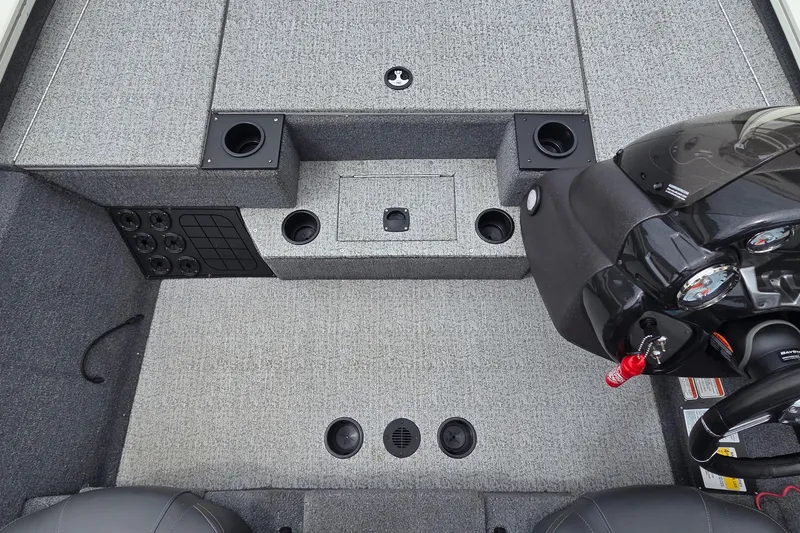 Slide: The Image of 2023 Tracker Pro Team 195 TXW Tournament Edition boat interior with dashboard and storage compartments. - 18